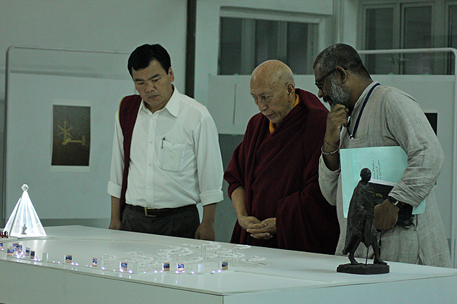Venerable Prof Samdhong Rinpoche is being briefed about Dandi Memorial Project by Sethu Das, Project Coordinator during his three-day long visit to IIT Bombay campus during the Dandi Memorial Sculptures' Workshops organised by IIT Bombay. Tenzin Dhonyoe, Personal Secretary to Prof Rinpoche next to them. Prof Rinpoche urged the project team members to make Dandi Memorial Project a meaningful cultural monument of Gandhi and his Satyagrahis.