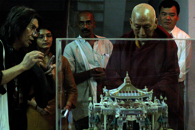 Atsuro Seto (Left), one of the Dandi Memorial Sculptors from Japan explains his 3D Mandala installation to Venerable Prof Samdhong Rinpoche, Former Prime Minister of Tibetan Government in Exile during his visit to IIT Bombay on December 22, 2013. Yeldtho Mathew and Rashmi Sidharthan of Friends of Tibet Foundation for the Wellbeing and Tenzin Dhonyoe, Personal Secretary to Prof Rinpoche next to him. Prof Samdhong Rinpoche was on a three-day visit to the campus in in connection with the Dandi Memorial Sculptures' Workshops organised by IITB.