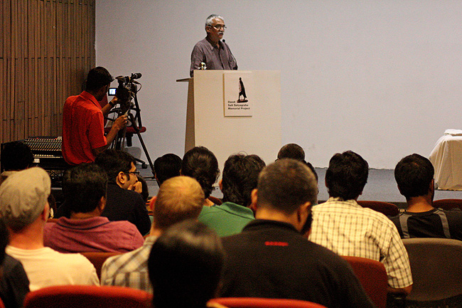Prof Kirti Trivedi, Convener of Dandi Memorial Project introduces Venerable Prof Samdhong Rinpoche, Former Prime Minister of Tibetan Government in Exile to the gathering at IIT Bombay during the Dandi Marchers' Sculptures Workshop II on December 21, 2013.