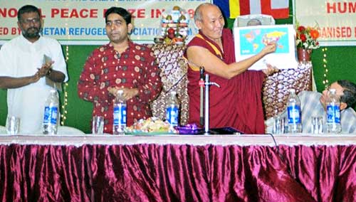 December 10, 2007: Venerable Geshe Lhakdor, Official Translator of His Holiness the Dalai Lama releases the first copy of the World Map with Tibet during the Human Rights Day observance on December 10, 2007 in Bombay. Next to him: Rohit Singh and Sethu Das of Friends of Tibet and Aspi Mistry of Dharma Rain Centre. (Photo: Friends of Tibet)