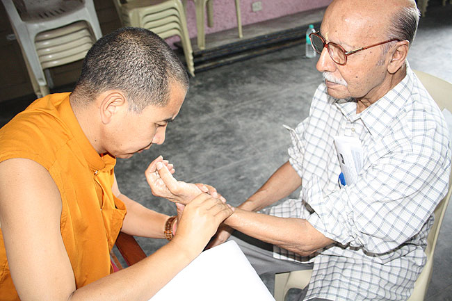 Medical Camp: Dr Lobsang Zoepa does pulse diagnosis during the 50th Anniversary of Men-Tsee-Khang, the Tibetan Medical and Astrological Institute of His Holiness the Dalai Lama in Kochi, Kerala with two-day long exhibition and free medical and astrological consultation on Tibetan Medicine and Astrological Calculation. The 11th Tibetan Medical Camp at Kochi organised jointly by Men-Tsee-Khang and Friends of Tibet (Kerala) was held at Ashirbhavan, Ernakulam from September 5-8, 2011.