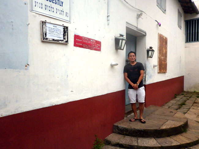 Pema Gyaltsen of Men-Tsee-Khang Bangalore branch in front of the Jewish Synagogue at Mattanchery, Kochi on the concluding day of the 21st Kochi Wellbeing Tibetan medical camp. This synagogue is one of the oldest and active ones historically used by the 'White Jews'. The Jewish Synagogue and the Mattanchery Palace Temple shares a common wall.