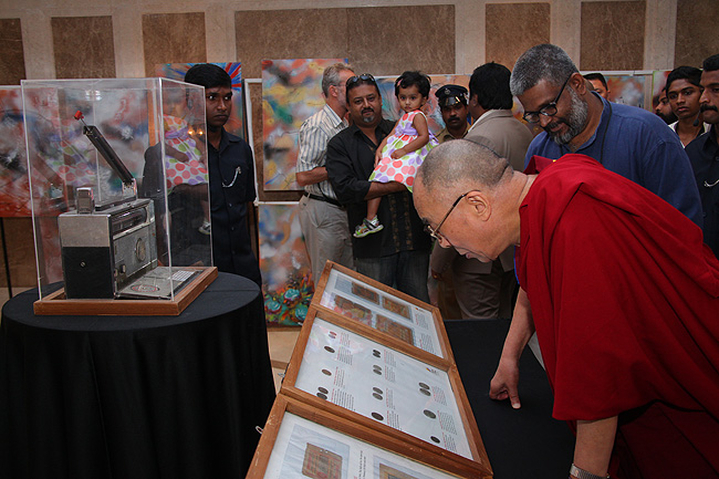 His Holiness the XIV Dalai Lama of Tibet looks at coins and currencies of the then free and Independent Tibet from the Friends of Tibet collection of Tibet artifacts. His Holiness was in Kochi to address a gathering of 'Friends of Tibet' members and 'Wellbeing' beneficiaries at the Holiday Inn on November 25, 2012. The Dalai Lama also spoke about 'The Art of Happiness' at a function organised by the 'Friends of Tibet Foundation for the Wellbeing'.