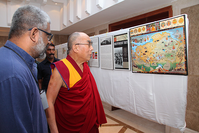 His Holiness the XIV Dalai Lama of Tibet looks at the map of Tibet from the Friends of Tibet collection of Tibet artifacts. His Holiness was in Kochi to address a gathering of 'Friends of Tibet' members and 'Wellbeing' beneficiaries at the Holiday Inn on November 25, 2012. The Dalai Lama also spoke about 'The Art of Happiness' at a function organised by the 'Friends of Tibet Foundation for the Wellbeing'.