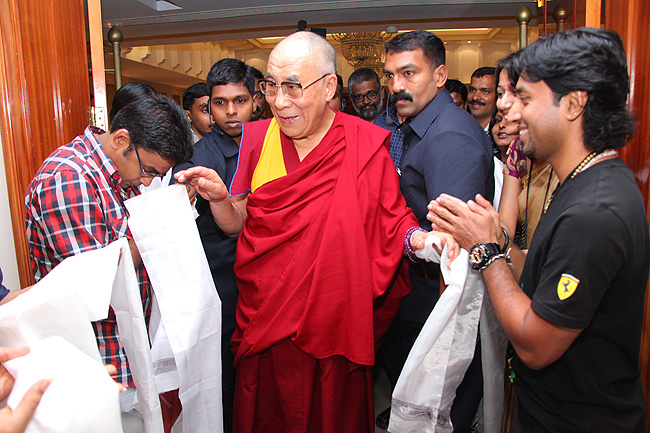 His Holiness the XIV Dalai Lama is being welcomed by Keval Shah and Nirmal Antony of Friends of Tibet. His Holiness was in Kochi to address a gathering of 'Friends of Tibet' members and 'Wellbeing' beneficiaries at the Holiday Inn on November 25, 2012. The Dalai Lama spoke about 'The Art of Happiness' at this event organised by the 'Friends of Tibet Foundation for the Wellbeing'.