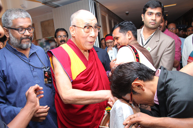 Dr Tenzin Norbu of Men-Tsee-Khang, Bangalore seeks blessings of His Holiness the XIV Dalai Lama while he was in Kochi to address a gathering of 'Friends of Tibet' members and 'Wellbeing' beneficiaries at the Holiday Inn on November 25, 2012. The Dalai Lama spoke about 'The Art of Happiness' at this event organised by the 'Friends of Tibet Foundation for the Wellbeing'.