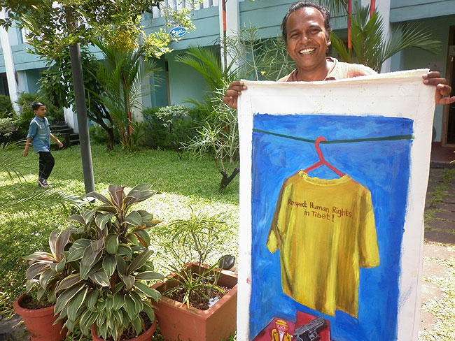 Brush Strokes For Freedom: Allennott's 'Shirt on Red Hanger' painting was made during the 2008 world-wide Olympic Protests. In recognition to the contributions of Friends of Tibet in highlighting the Tibet issue, Allennott donated two of these paintings, during his visit to the Wellbeing Camp, Kochi. (Photo: Friends of Tibet)