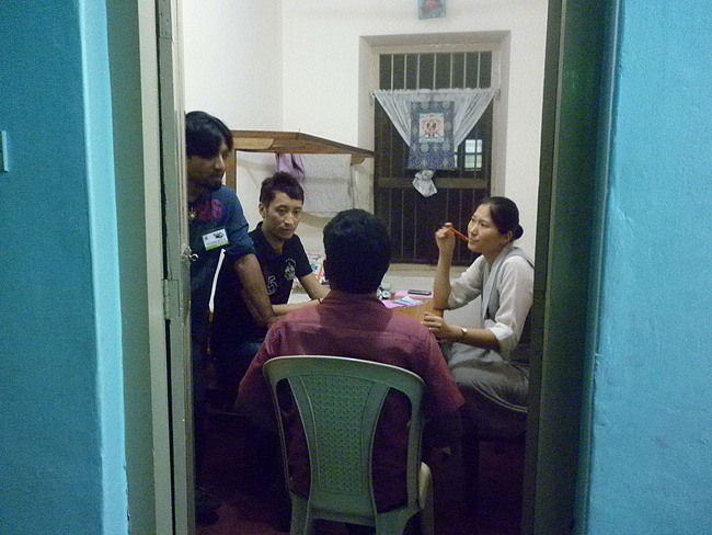 Dr Passang Tsering Triunkha and Dr Tenzin Lheundup during consultation. Nirmal Antony, Musician and a Wellbeing Programme Coordinator helps the doctors with translation. 
