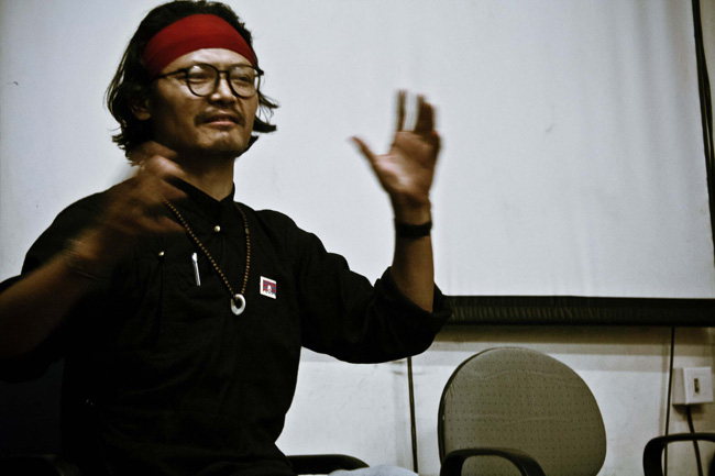 Exiled But Rooted: Jamyang Phuntsok, Tibetan poet in exile and a postgraduate in Physics recites his poem 'When It Rains in Dharamshala' during World Tibet Day event in New Delhi on July 6, 2011.