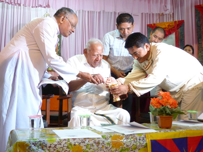 Padma Vibhushan Justice Dr VR Krishna Iyer inaugurates the golden jubilee celebrations of Men-Tsee-Khang by lighting a traditional Tibetan butter lamp on September 6, 2011. Dr Dorjee Rapten Neshar (Chief Medical Officer, Men-Tsee-Khang Bangalore branch); Rev Fr Monsignor Joseph Thannikkottu (Director, Ashirbhavan); Dr Lobsang Zoepa (Men-Tsee-Khang, Dharamshala) and Men-Tsee-Khang staffs next to him.