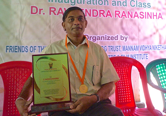 Dr Ravindra Ranasinha being presented with 'Kavalam Narayana Panikker Award' for his outstanding contribution to the field of Drama-Therapy by Aryad Bhargaven, Director, World Dramatic Study Centre & Film Institute, Alappuzha.