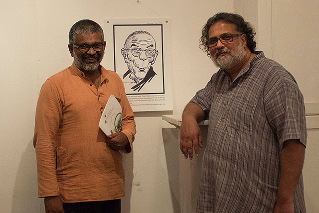 Tushar Gandhi (Right), great-grandson of Mahatma Gandhi with Sethu Das, Founder of Friends of Tibet in front a Dalai Lama caricature by RK Laxman, two personalities they both admire.