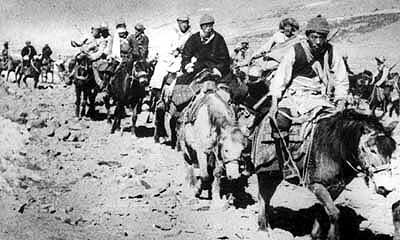 The Dalai Lama escorted by Tibetan resistance fighters -- leaving Tibet to seek asylum in India (March 1959)