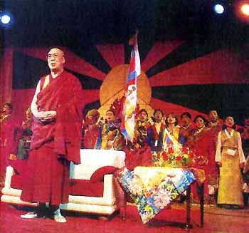 His Holiness the XIVth Dalai Lama standing in front of throne
        for Indian national anthem
