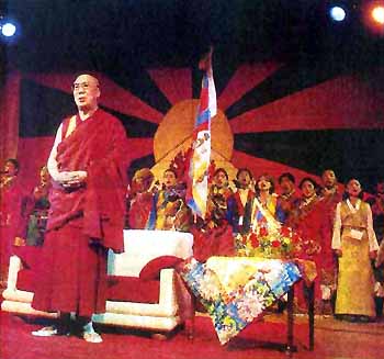 His Holiness the XIVth Dalai Lama standing in front of throne
        for Indian national anthem