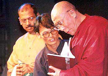 HH Dalai Lama realeases the book 'Breaking Silence: In Support of Tibet'
    during the inauguration of the Festival. 
    Bertie D'souza (Designer) and Tenzin Tsundue are next to him.