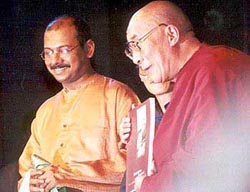 His Holiness displaying the book 'Breaking Silence'