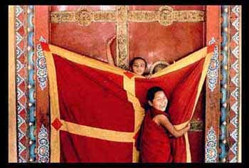 Young nuns at the monastery door, Kathmandu, Nepal