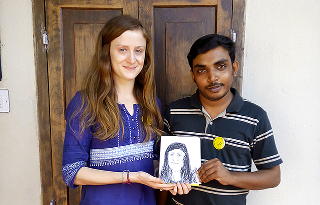Caricaturist and Wellbeing Volunteer Sreejith Saseendran (Right) with a caricature of Victoria Sheldon, another Wellbeing Volunteer during the 48th Wellbeing Tibetan Medical Camp held at Centre for Social & Political Art (CSPA), Sylviander House, Alappuzha, Kerala from January 28-29, 2016.