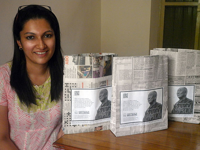 Diwia, Founder of PaperTrail with paper bags her organisation manufactured with used newspapers for the Wellbeing camps run by Friends of Tibet. Hundreds of newspaper bags are being manufactured everyday and every woman worker is able to contribute to her family expenses. (Photo: Friends of Tibet)